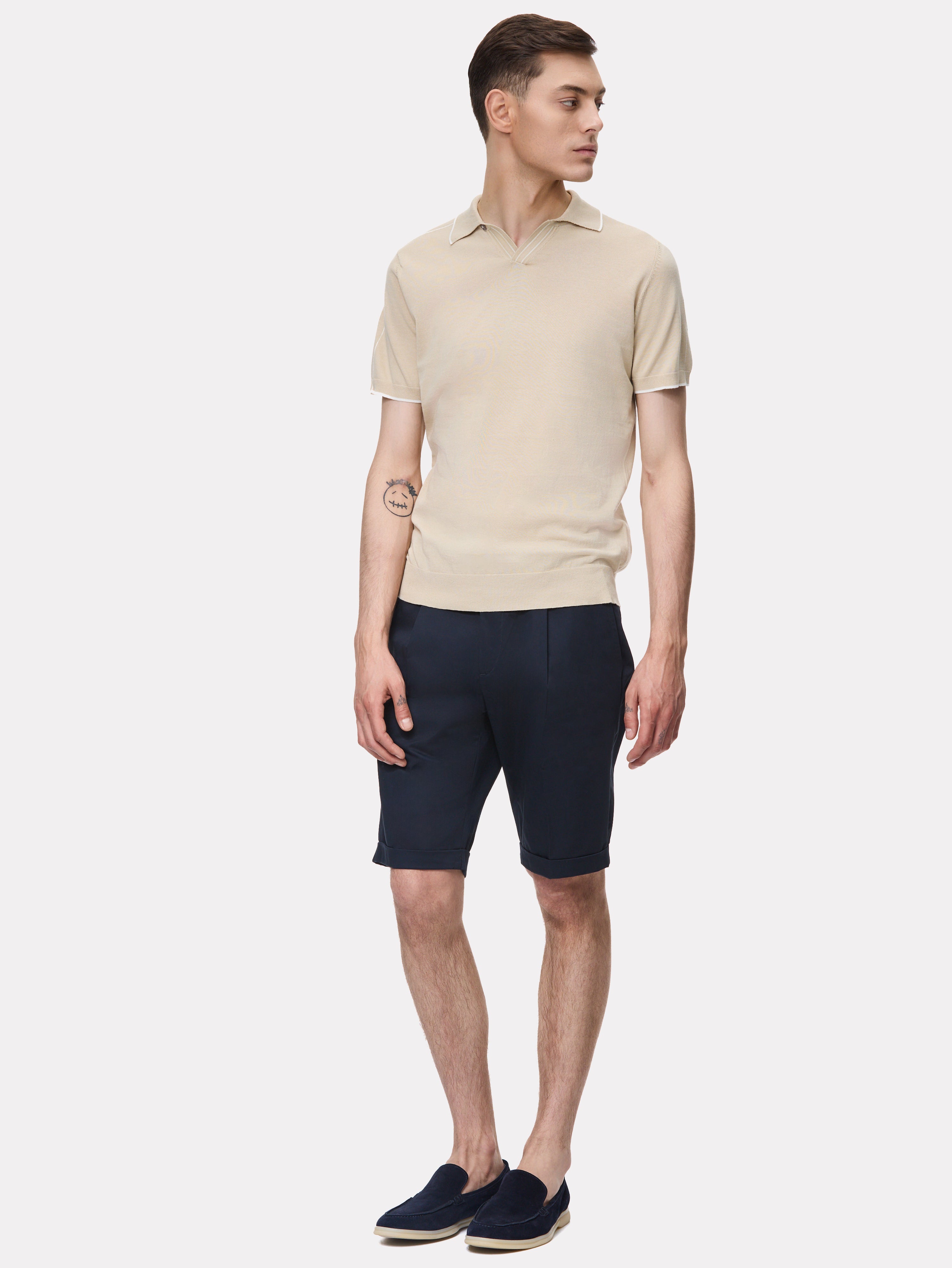 Beige polo shirt with white stripes