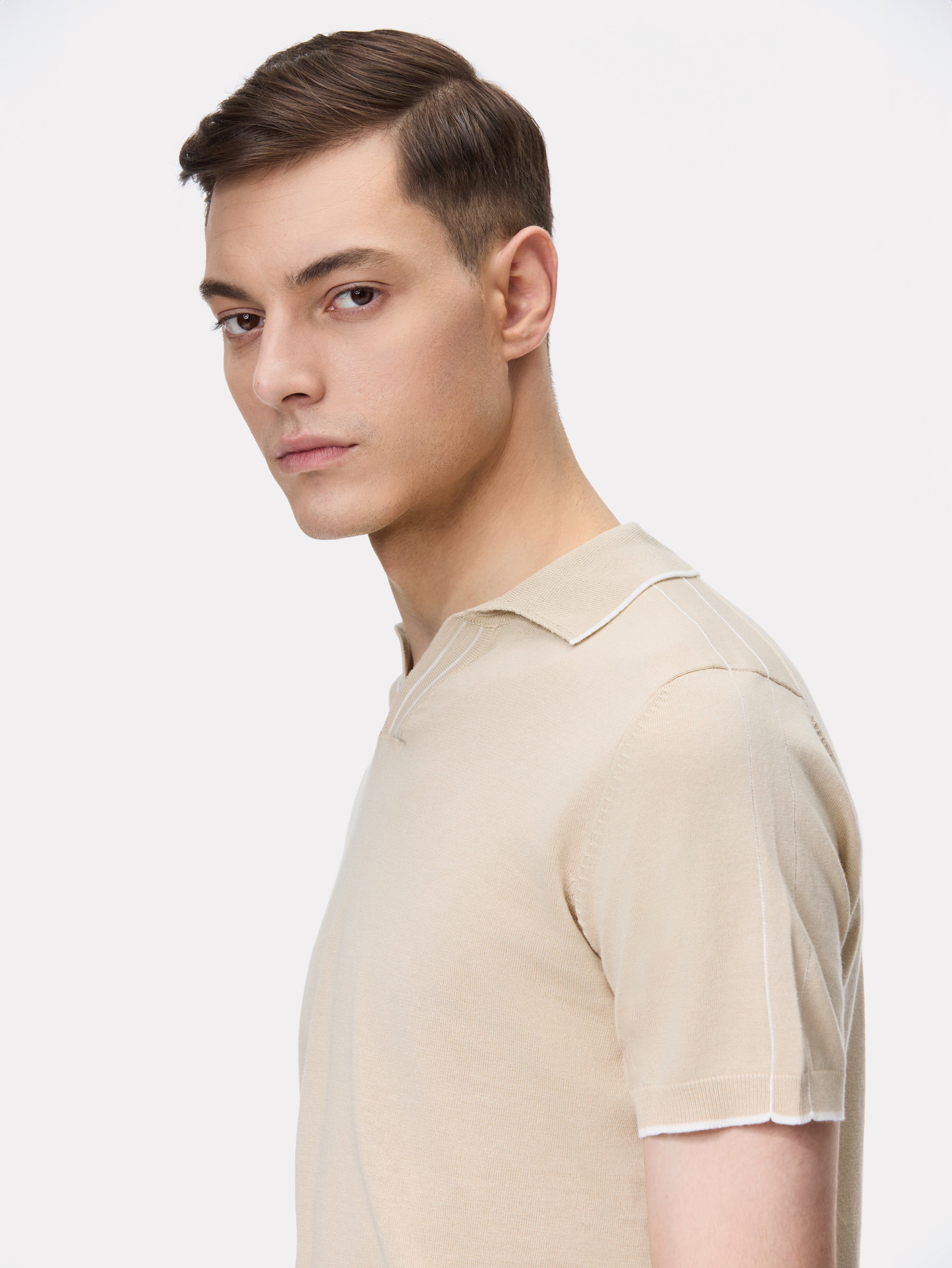 Beige polo shirt with white stripes