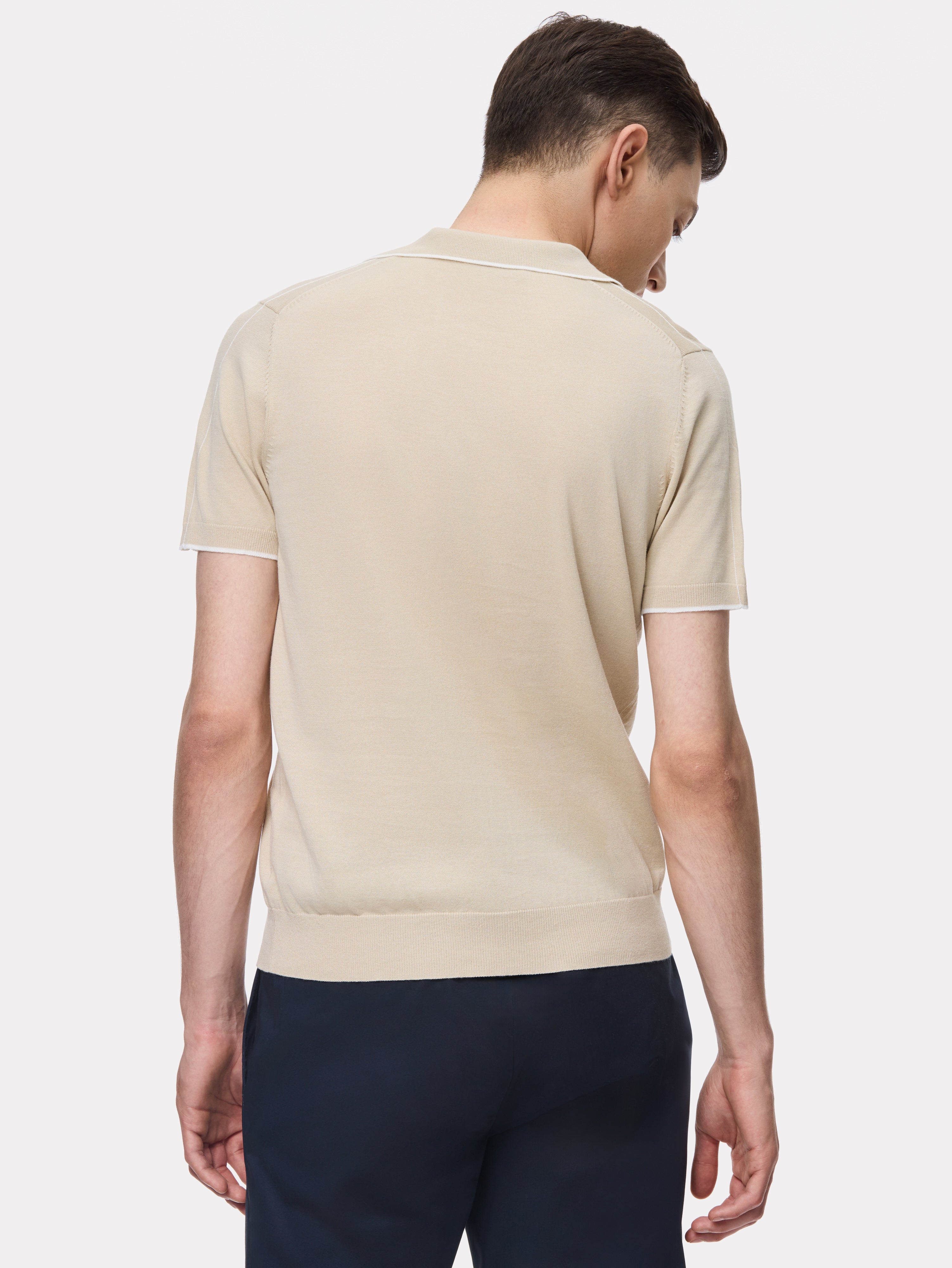 Beige polo shirt with white stripes