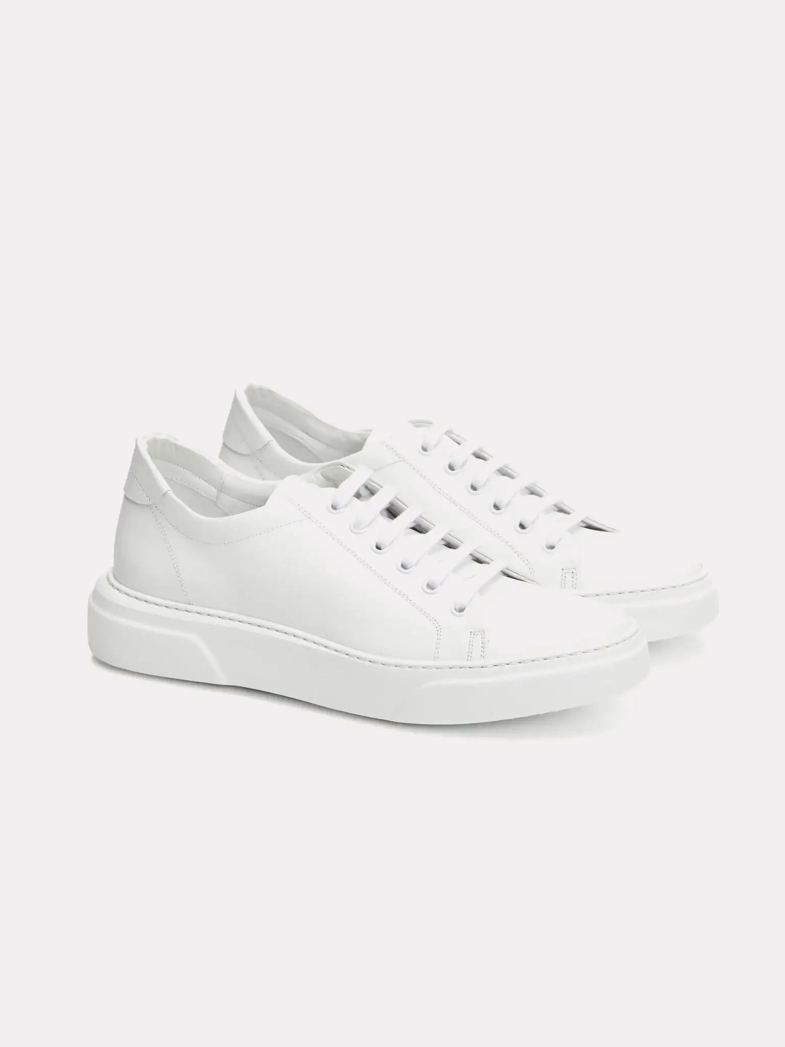 White sneakers with gold logo
