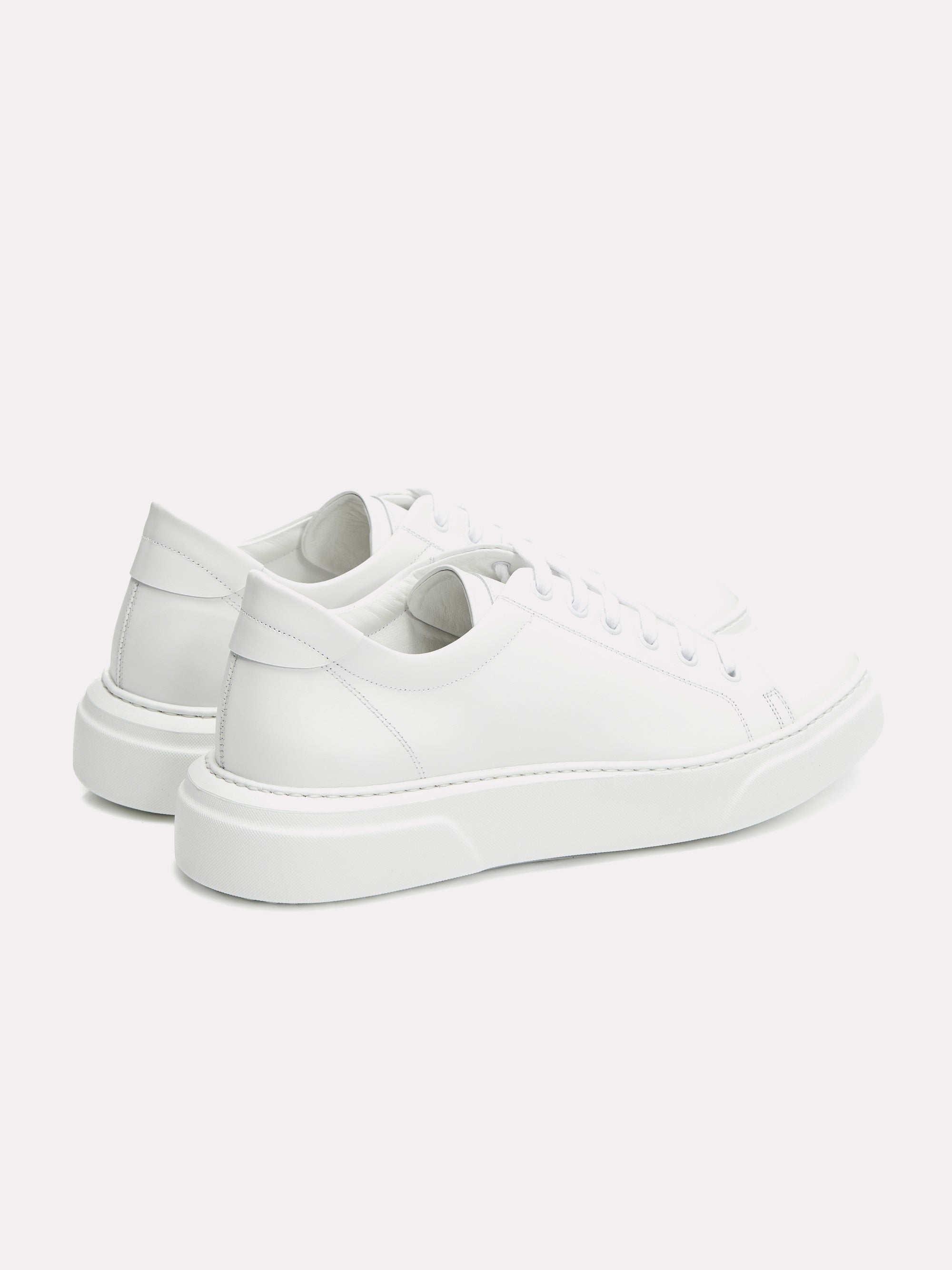 White sneakers with gold logo
