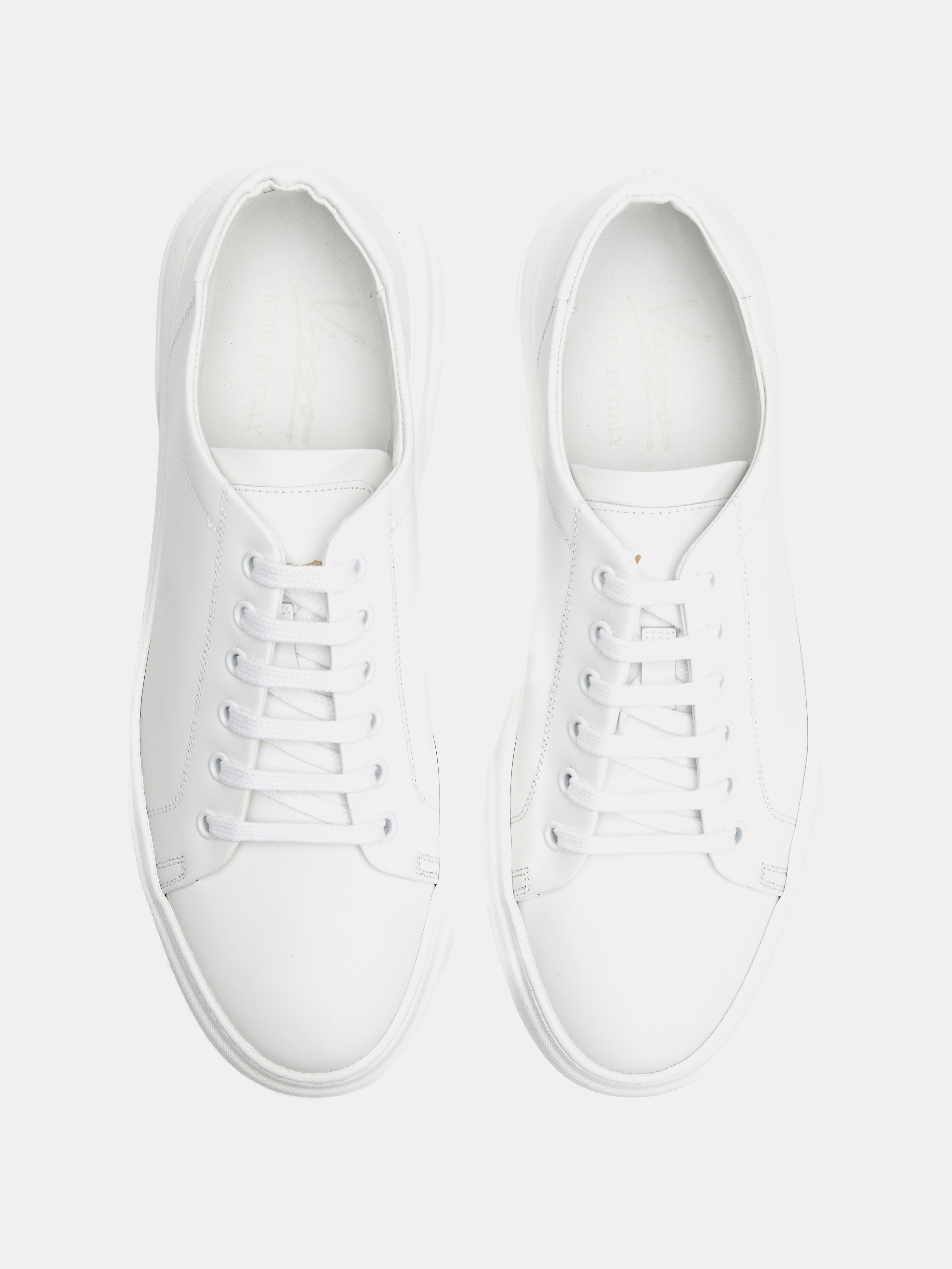 White sneakers with gold logo