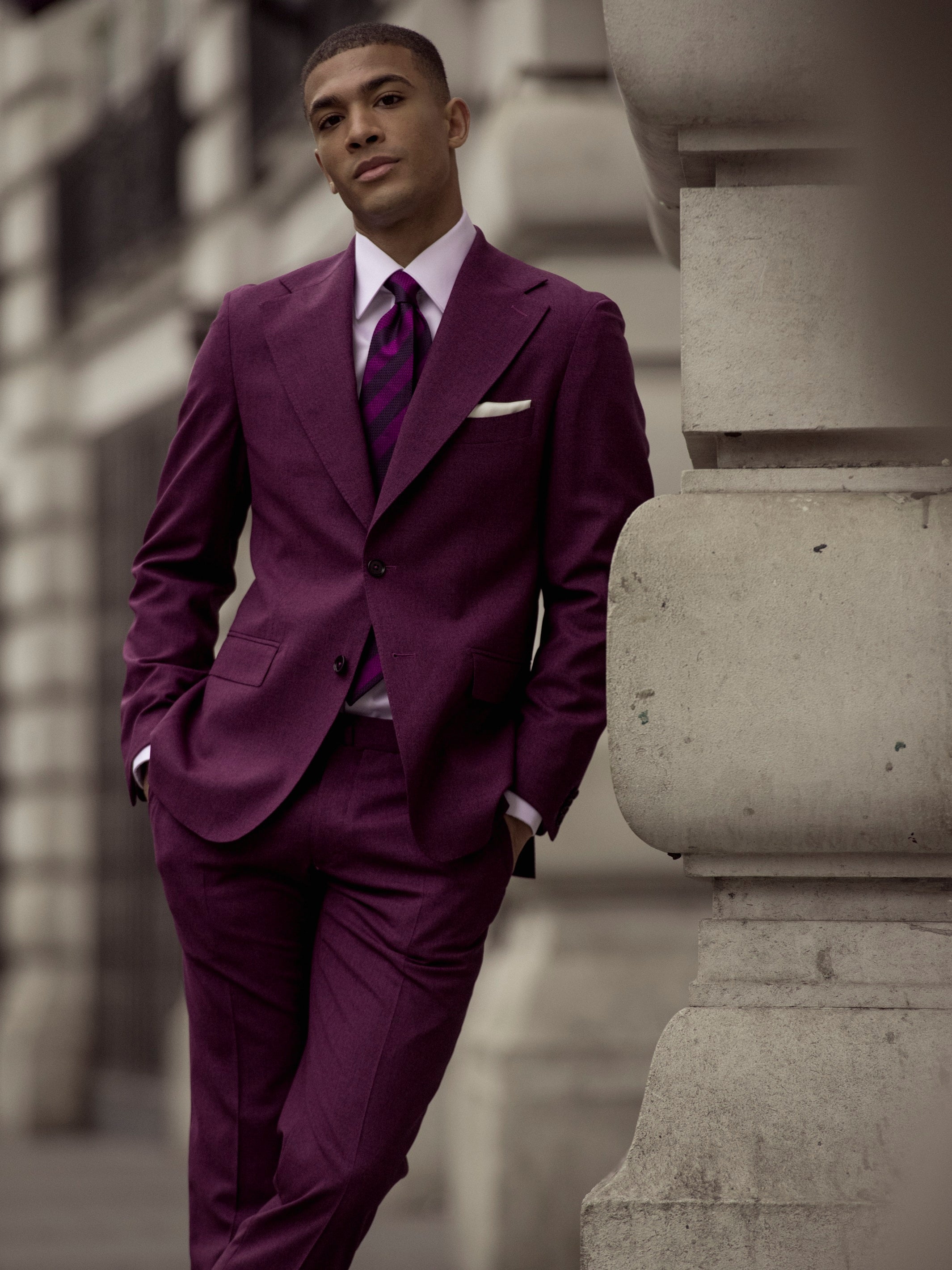 Textured purple two-piece suit on a black background, tailored fit
