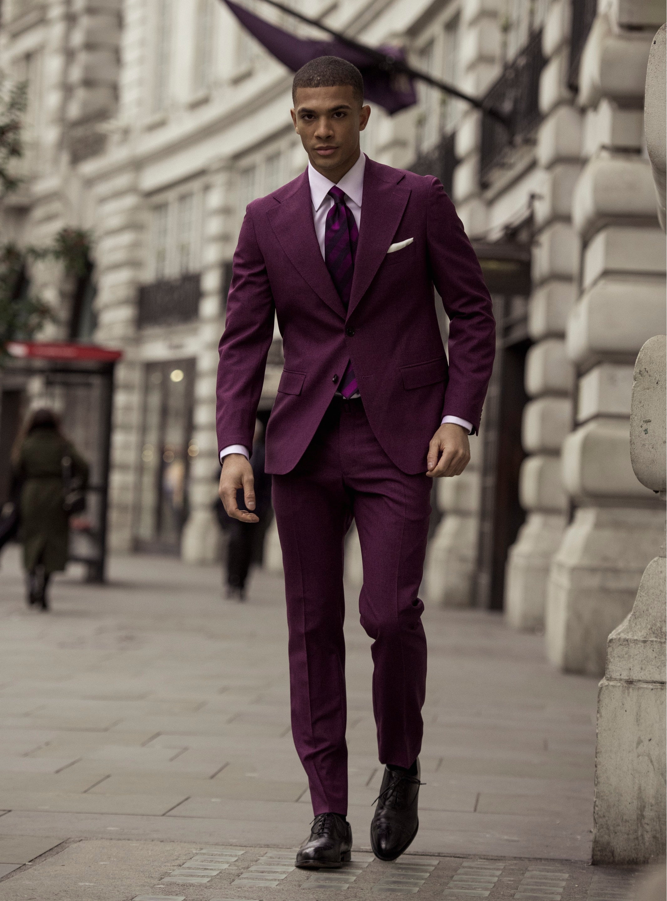 Textured purple two-piece suit on a black background, tailored fit