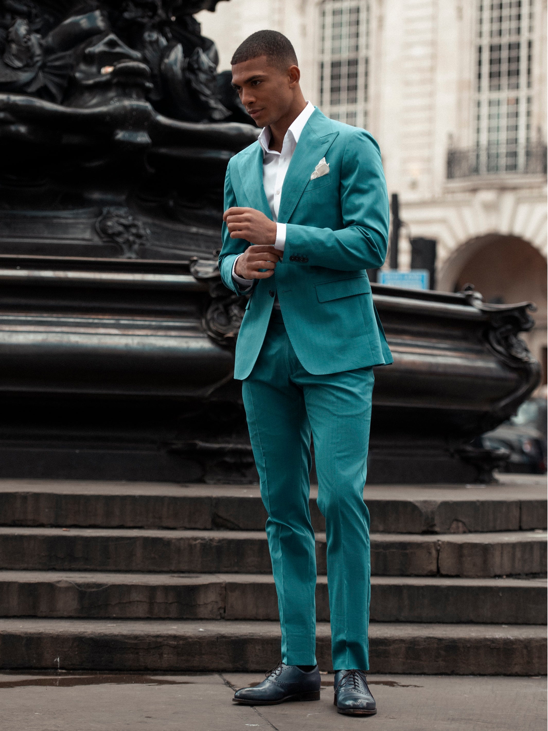 Two-piece turquoise suit with tone-on-tone stripes, tailored fit