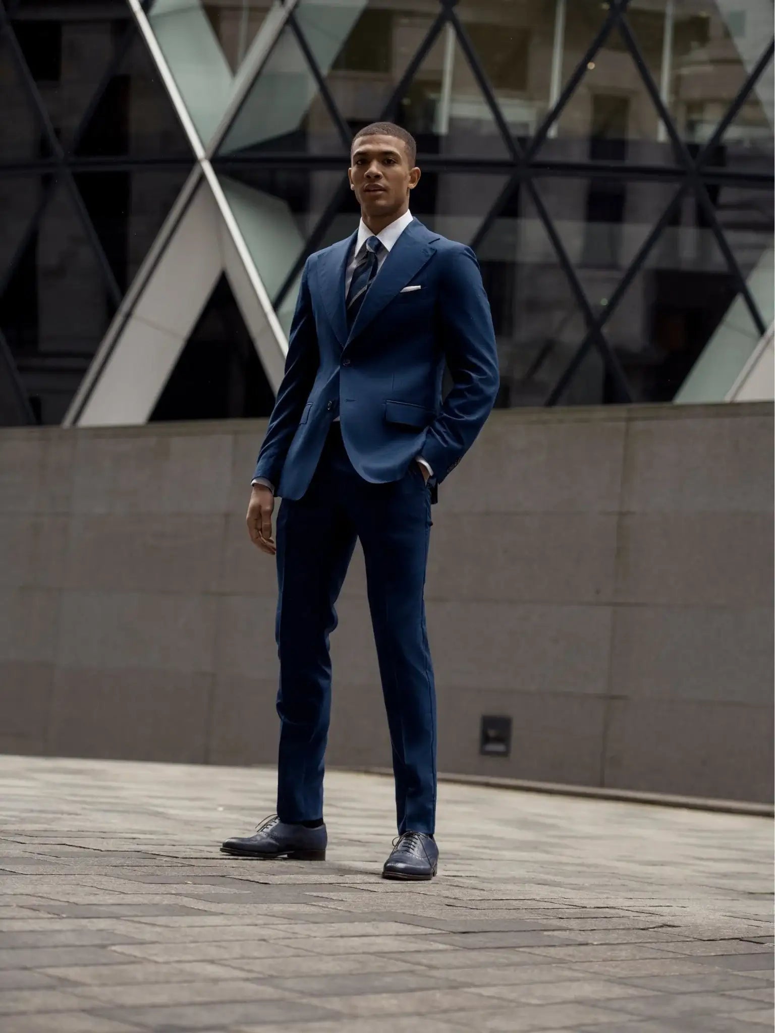 Navy blue two-piece suit with fine texture, tailored fit