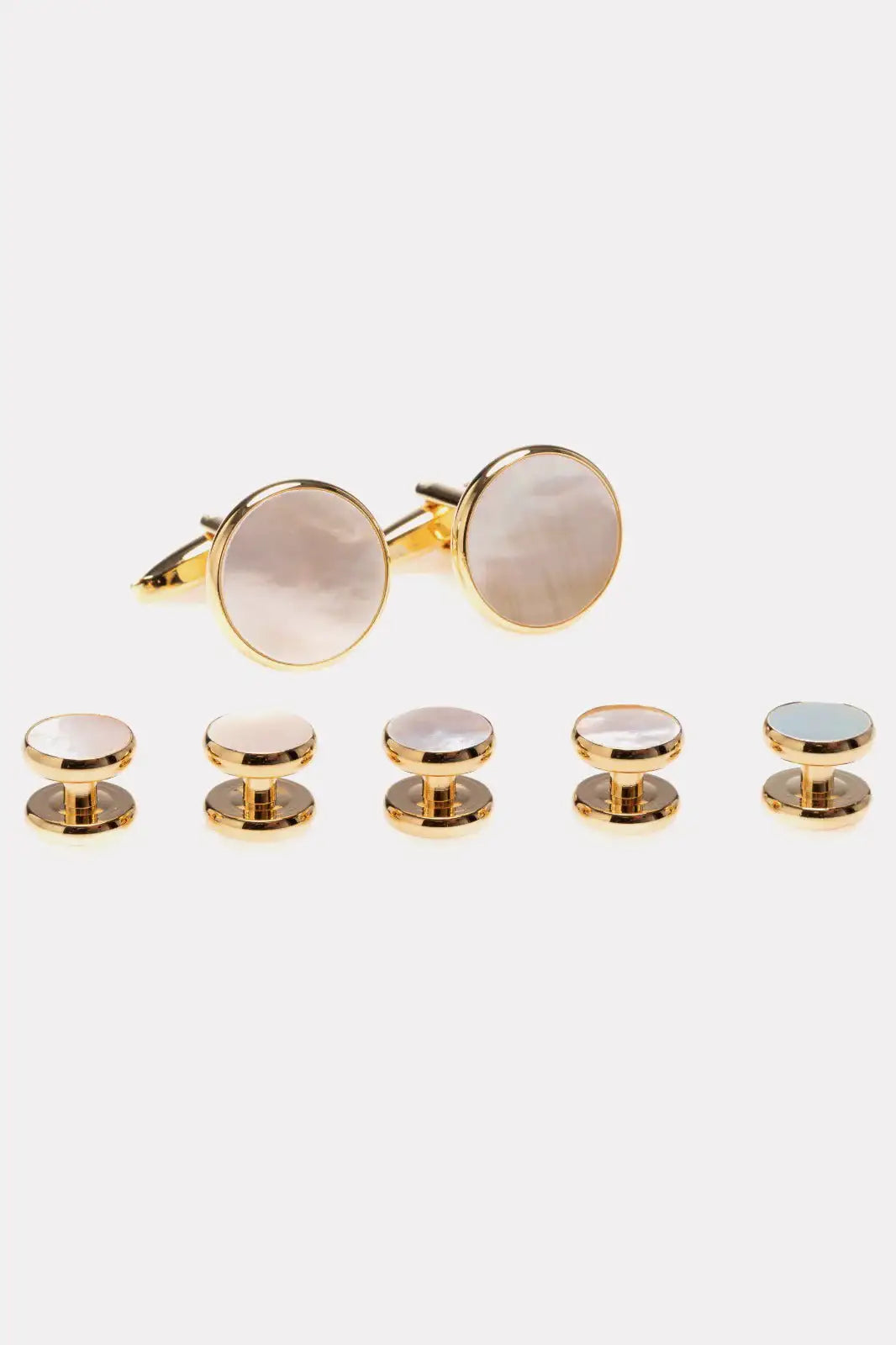 Set of golden cufflinks and buttons with white stone