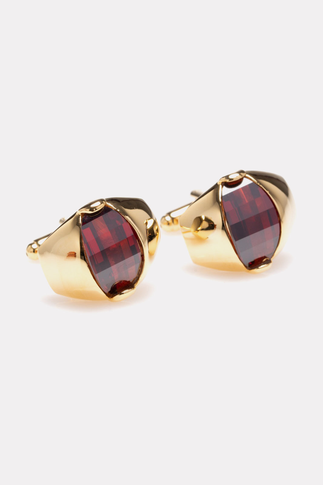 Oval golden buttons with bordeaux stone