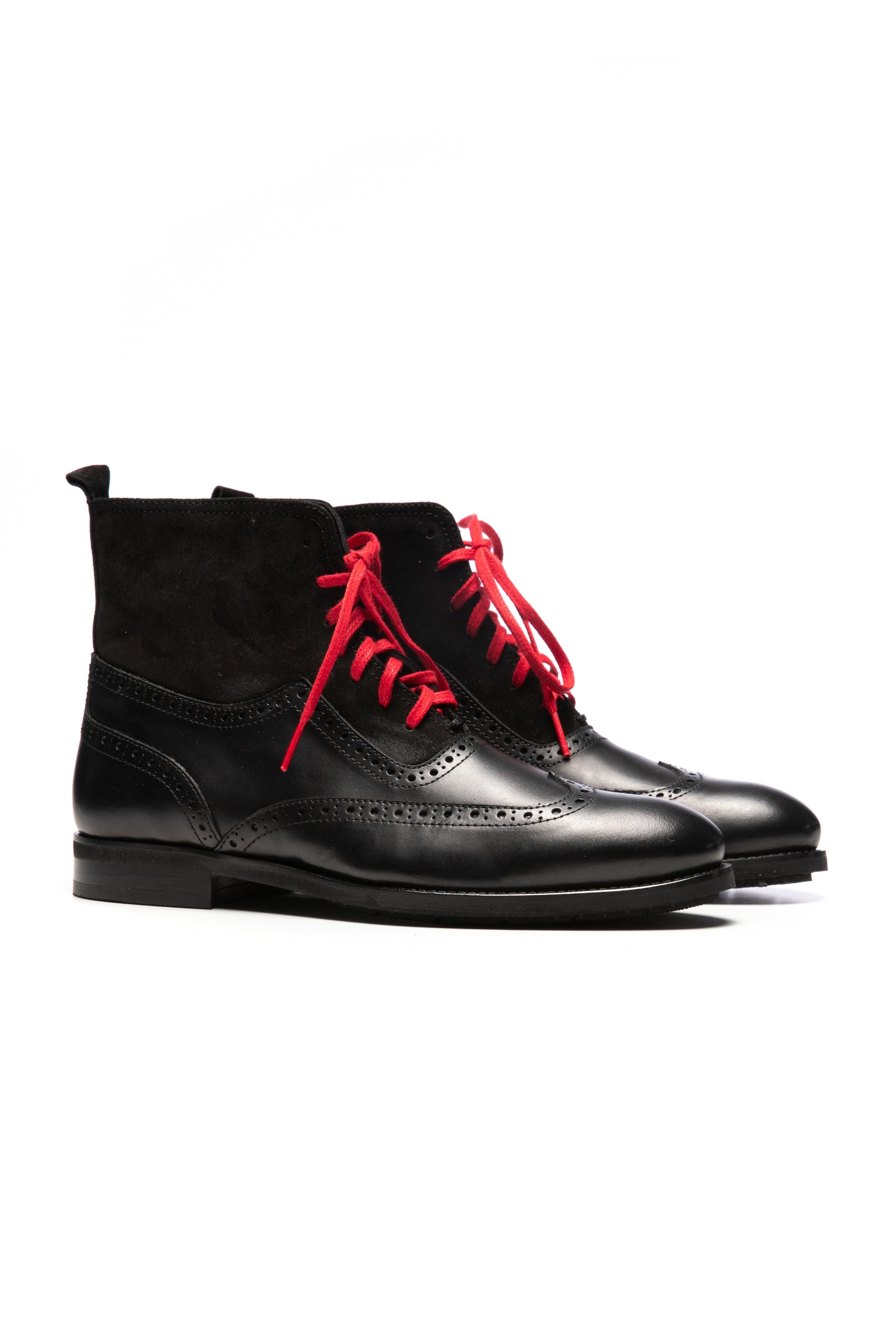 Black brogue model boots