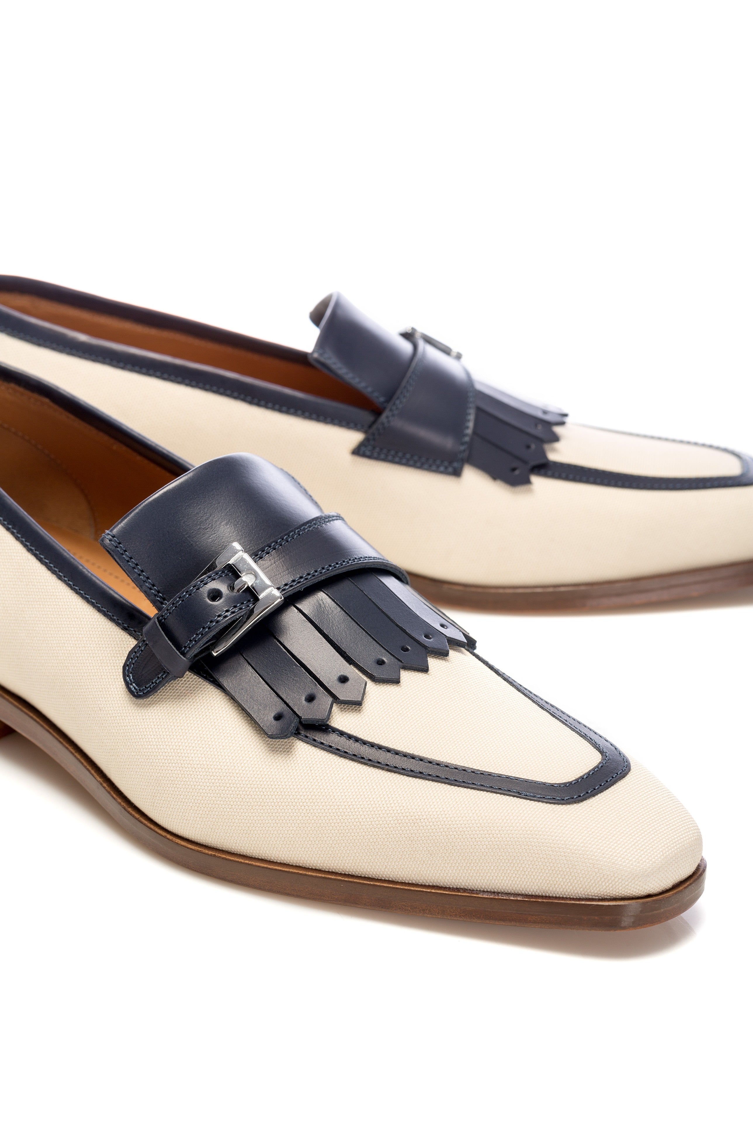 Two-tone leather and textile tassel moccasins