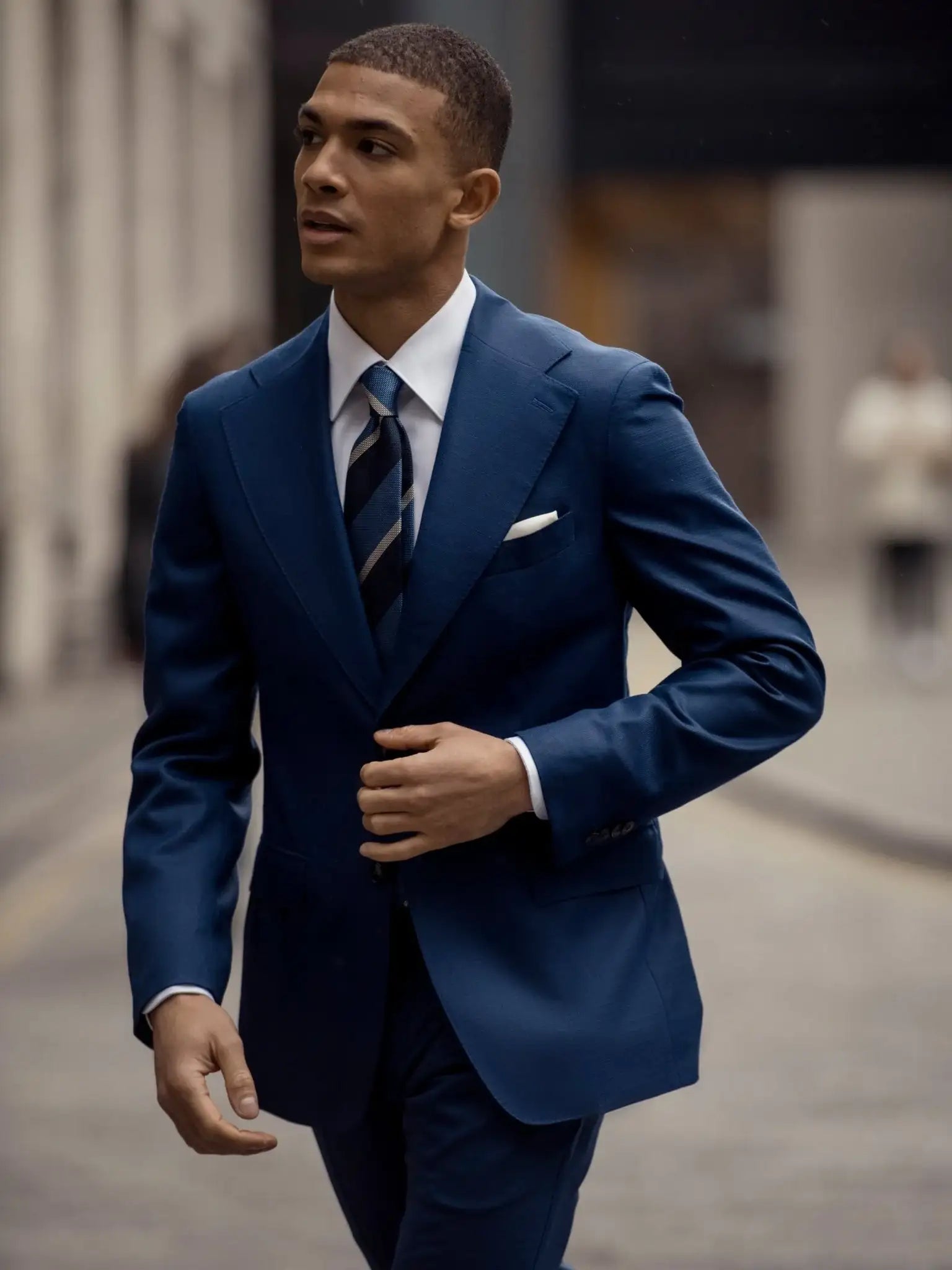Navy blue two-piece suit with fine texture, tailored fit